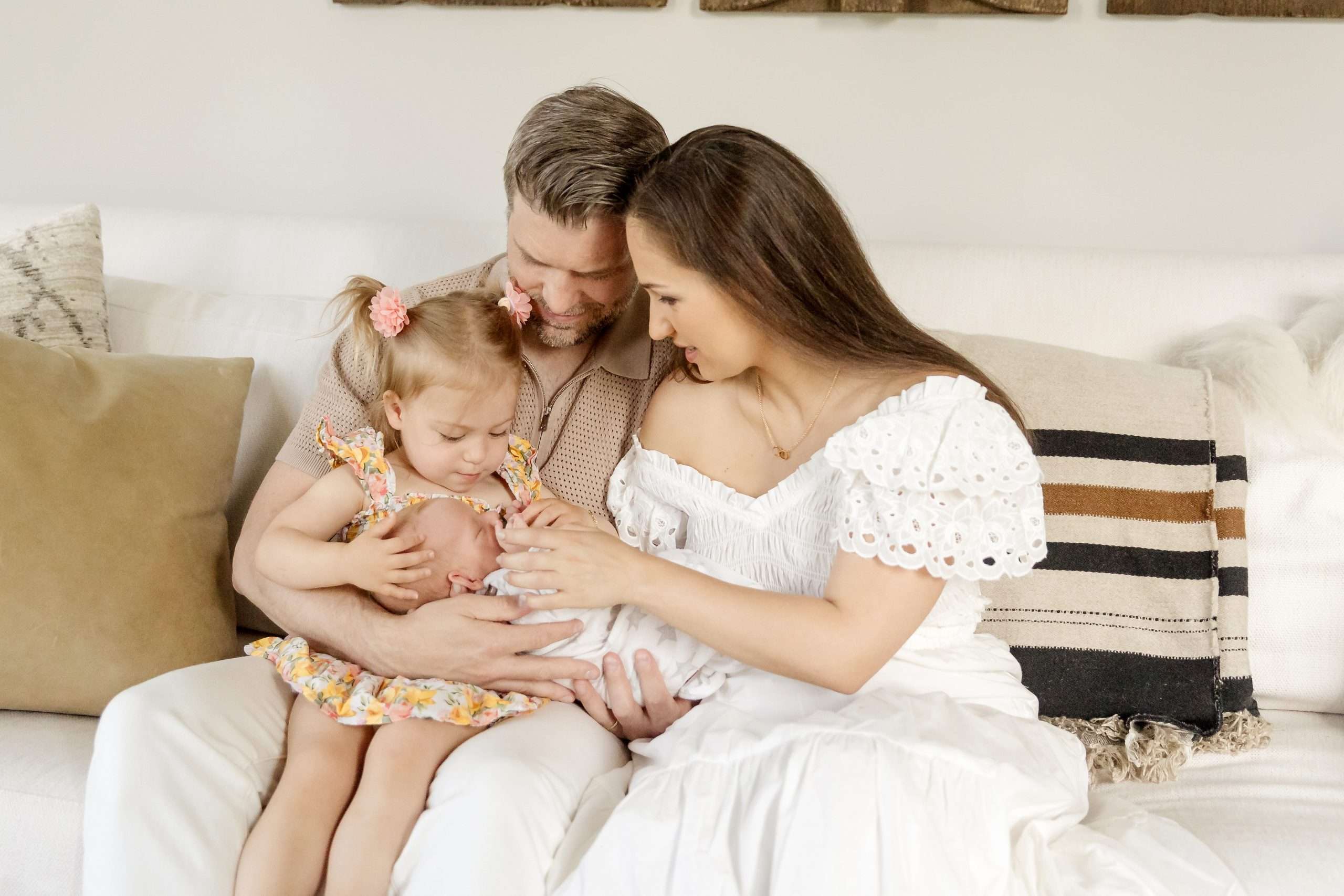 family of four with their newborn
