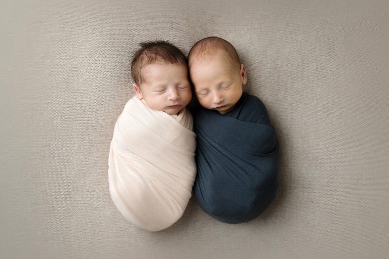 newborn twins, one boy one girl, swaddled together in minneapolis studio