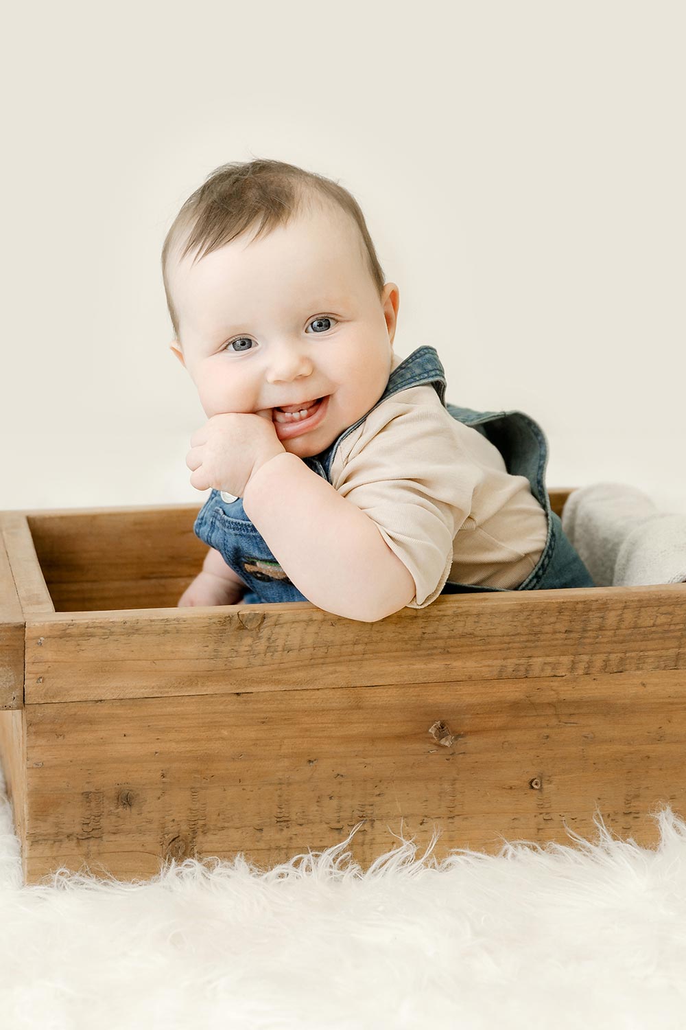 sitter milestone session, baby boy in brown crate in minneapolis photography studio