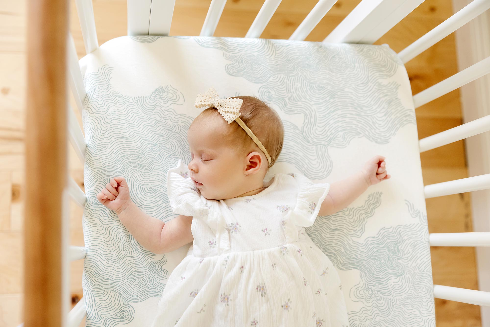 newborn girl sleeping in her crib at home in minnetonka mn