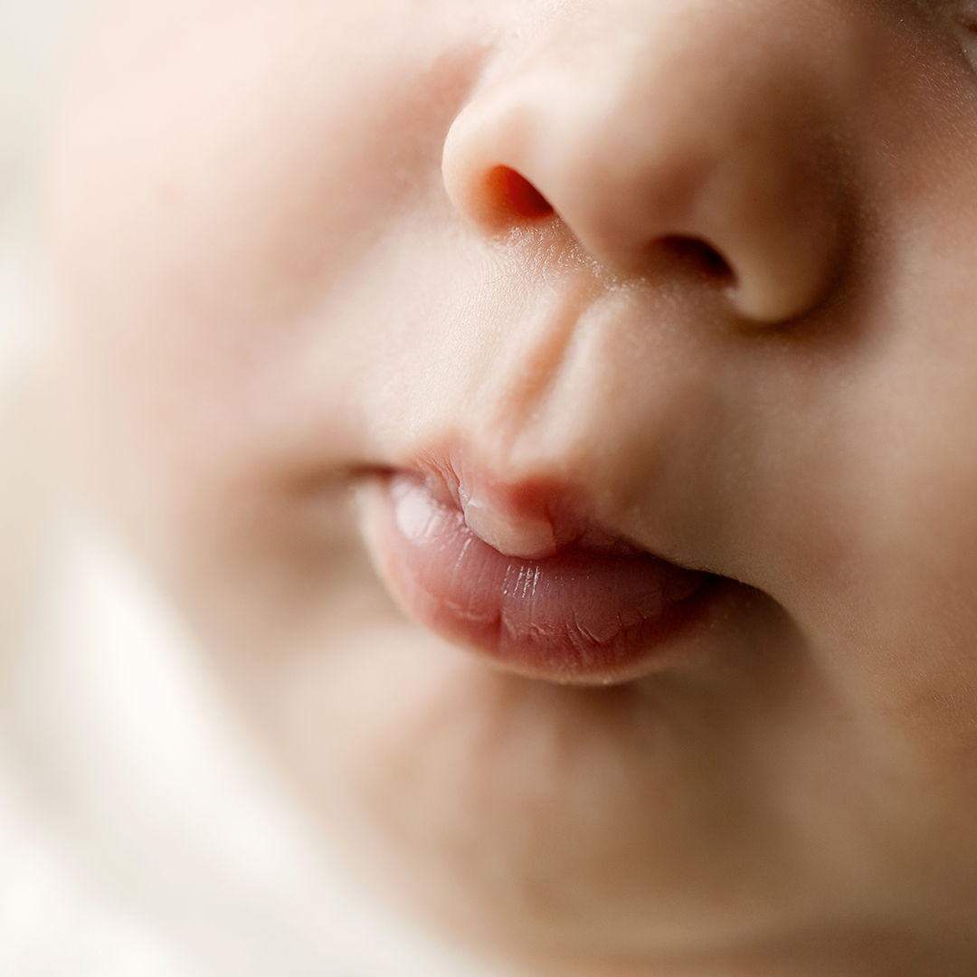 macro shot of newborn pursed lips