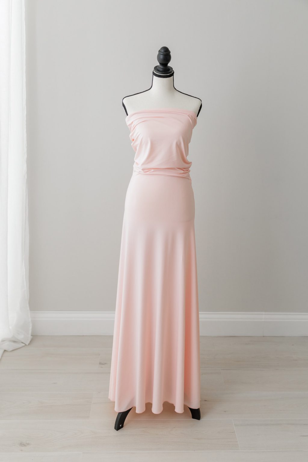 light pink sleeveless stretchy maternity dress